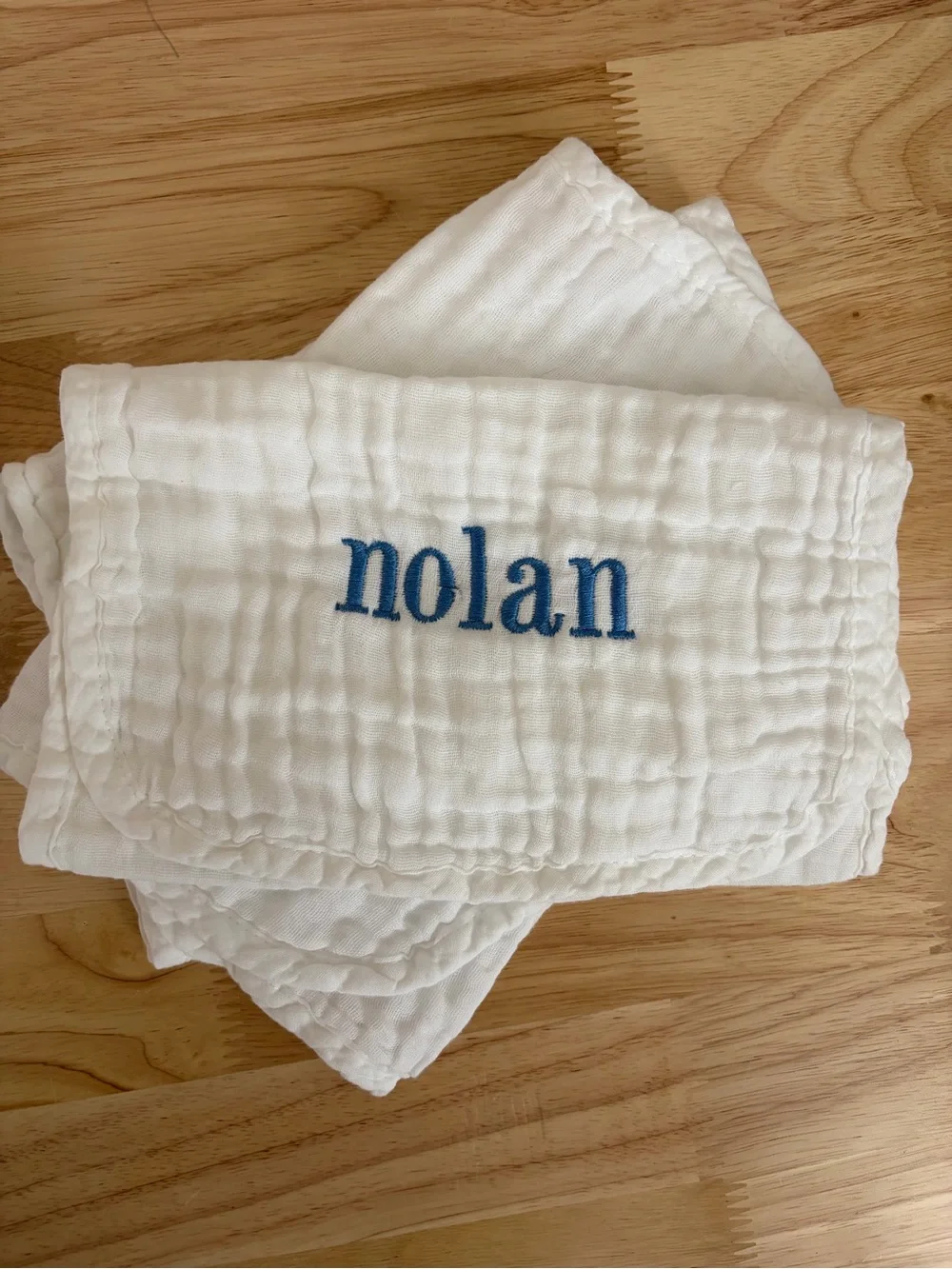 Personalized White Baby Bib with Blue Embroidered Name